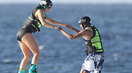 Kylie Jenner & Tyga Hold Hands As They Try Out Their Jetpacks